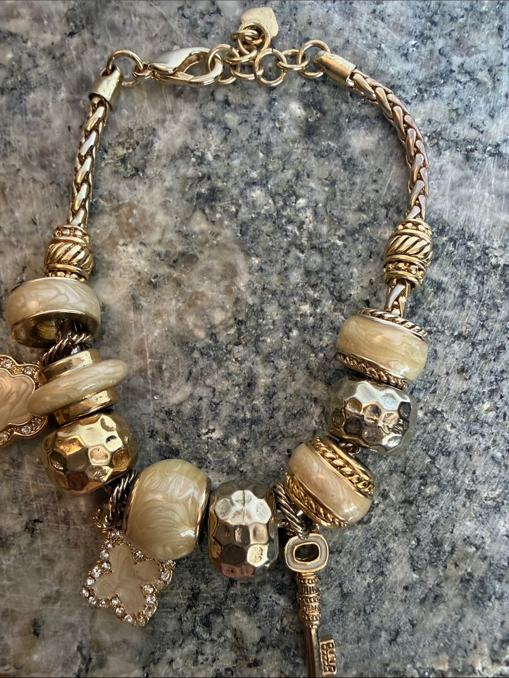 Gold-Tone Charm Bracelet with Cream Beads and Key Charm